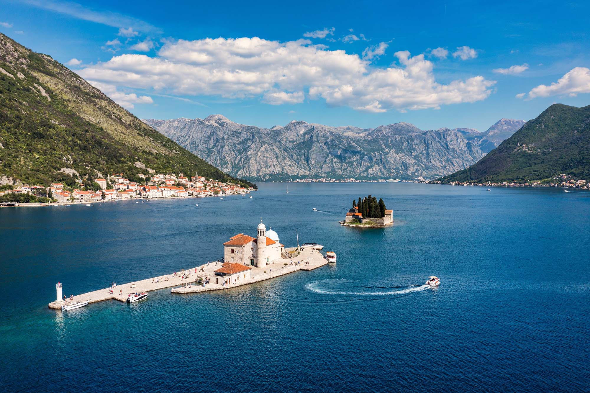 Saint George Island and Church of Our Lady of the Rocks in Perast, Montenegro. Our Lady of the Rock island and Church in Perast on shore of Boka Kotor bay (Boka Kotorska), Montenegro, Europe.