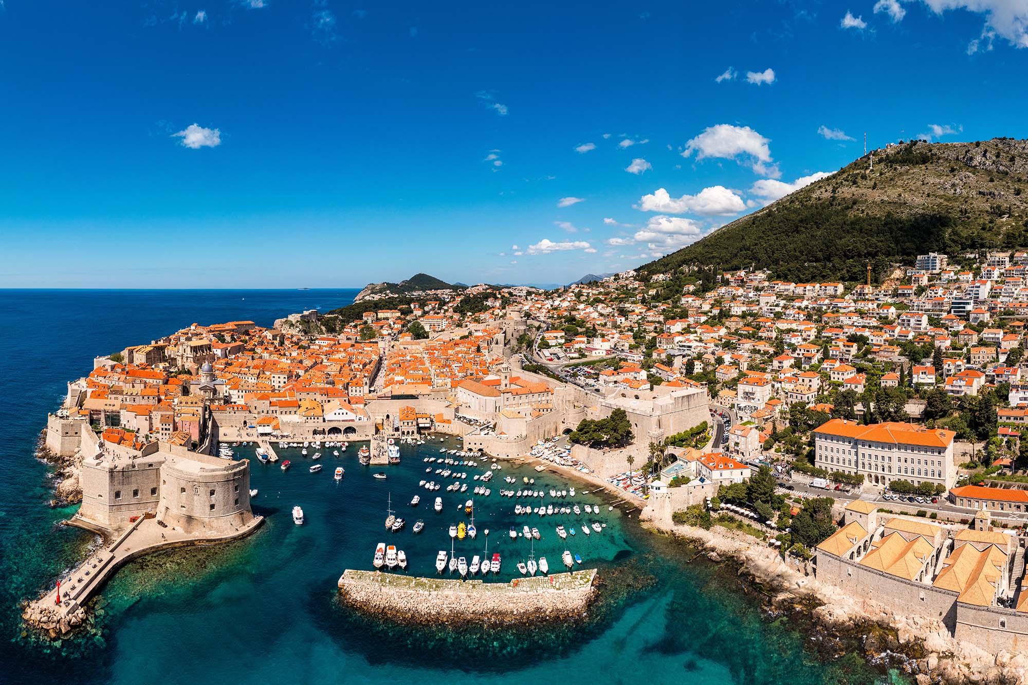 Dubrovnik a city in southern Croatia fronting the Adriatic Sea, Europe. Old city center of famous town Dubrovnik, Croatia. Picturesque view on Dubrovnik old town (medieval Ragusa) and Dalmatian Coast.